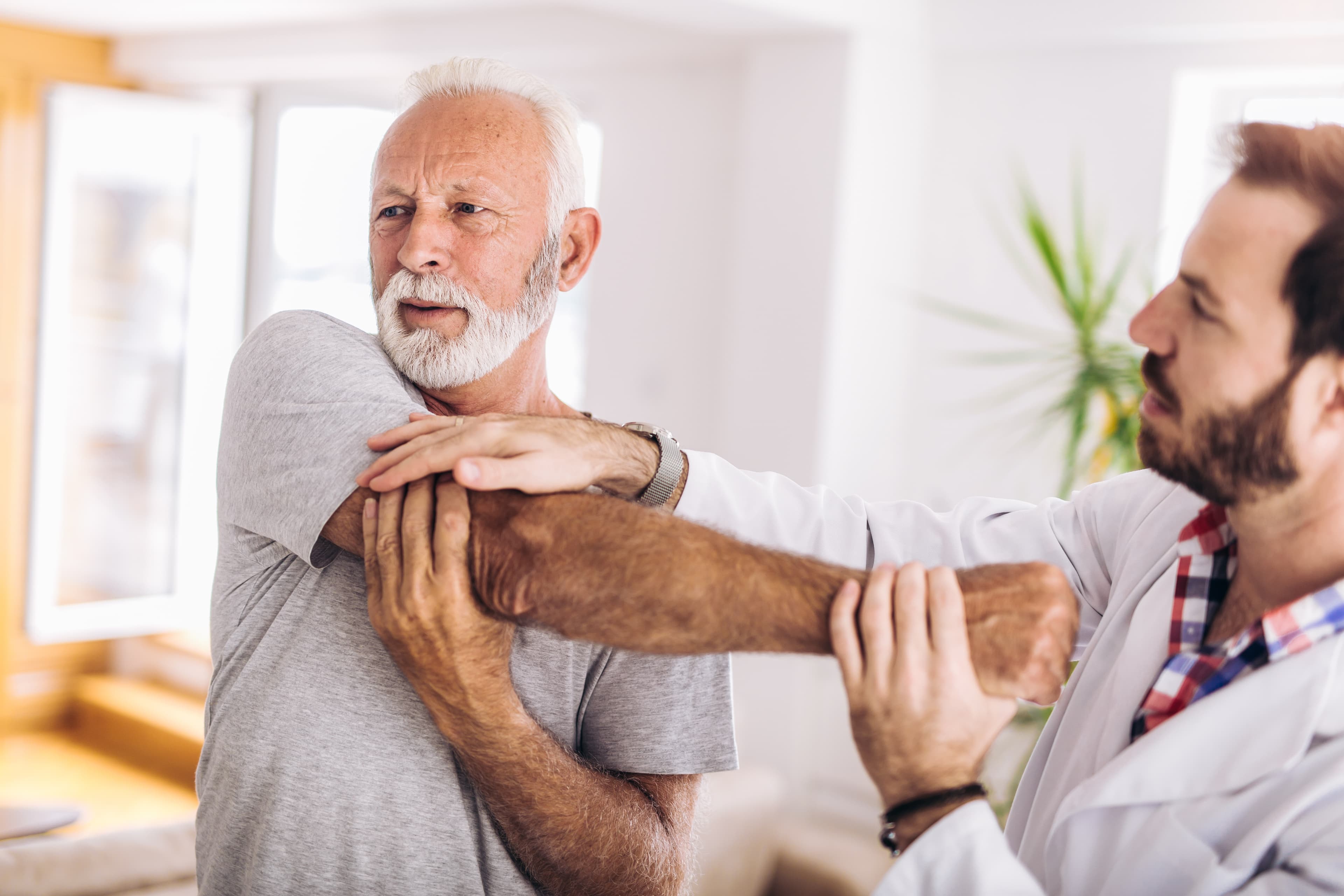 Physical therapist working with patient